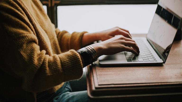 Typing on Laptop