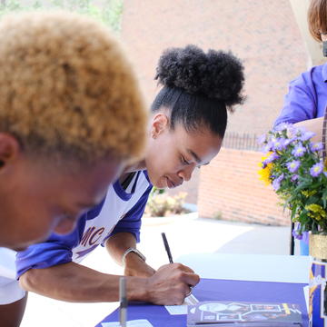 Student signing